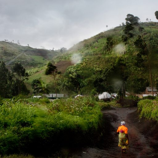 Villagers return from the local market during a rain storm in Muheto, North Kivu province, Democratic Republic of the Congo, DRC, on Oct. 15, 2009. It usually takes hours to travel from one village to another suring bad weather conditions.