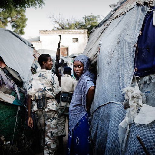 Soldiers patrol a camp for internally displaced persons, IDPs, at the Al Hijra refugee camp in the Shangani district of Mogadishu, Benadir region, Somalia on Nov. 13, 2008. Some of the residents in this camp have been living here since 1995. The past two years have seen the deadliest violence in Mogadishu since its inception nearly two decades ago, displacing a staggering 600,000 Somalis from February to November of 2007 alone. Over one million internally displaced persons, IDPs, in and around the capital are forced to live in over crowded camps, often without water or electricity, and are exposed to fatal diseases due to unsanitary conditions and malnutrition. Escalating violence has forced aid workers out, leaving the IDPs with little to no aid.
