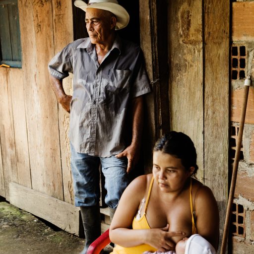 Abelardo Antonio Tabares Castaño,50, stands at his home with his family in Penazorà, a hamlet near Puerto Asís, Putumayo, Colombia on Feb. 26, 2009. Castaño is a farmer who was threatened from his "finca", or ranch, in the municipality of Teteyé two years ago. He lost two sons to armed militias who took them.
