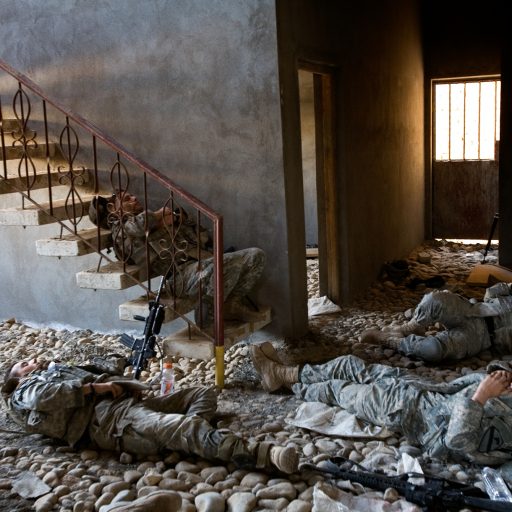 Soldiers from the Apache Troop, 6th Squadron, 9th Cavalry Regiment, 3rd Brigade, 1st Cavalry Division, relax between intensive house to house searches during a two day operation on the outskirts of Muqdadiyah, Diyala province, Iraq on Oct. 4, 2007. The area, approximately 90 kilometers north of Baghdad, is a known al Qaeda stronghold
