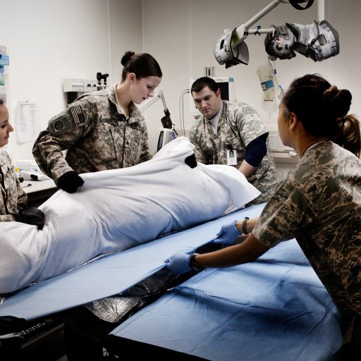 U.S. military nurses treat a wounded soldier in the Emergency Room of Bagram's SSG Heath N. Craig Joint Theater Hospital at Bagram Air base, north of Kabul, Afghanistan on Jan. 13, 2010.