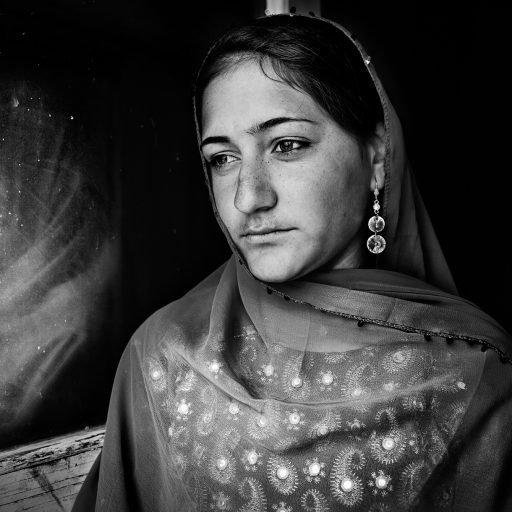 Marian, 15, poses for a portrait in her house in Kabul, Afghanistan on Jan. 20, 2010.
In two weeks she will be married in Gazni and her family will receive 2,000 USD from the husband's family. That money will ensure the survival of her family for the next two years at least. Her father was a Taliban before the fall of Mullah Omar's regime and was wounded, according to him, by a personnel landmine, becoming paraplegic and losing one leg a year ago.