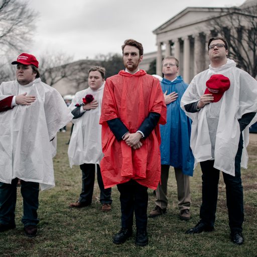 Washington, DC - January 20, 2017: Trump supporters stand for the national anthem during the end of the inauguration ceremony of Donald J. Trump, the 45th president of the United States. Photo: Christopher Lee.