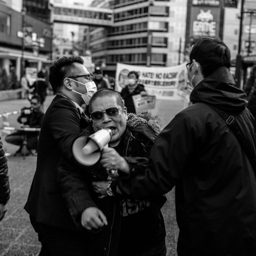 **NO RESALES, NOT IN ARCHIVE** STORY TO BE HELD FOR LATER DATE

Tokyo, Japan - November 25, 2017: An anti hate speech protester is carried away by ultra rightwing Japanese nationalists during an anti Korean demonstration outside of Ikebukuro Station in Tokyo. Combined with a sharp rise in ultra rightwing nationalist sentiment in Japan and the turbulent relations between North Korea and the world, anti Korean demonstrations and sentiment have become more frequent in not only the internet political sphere but in public forums as well. Photo: Christopher Lee.