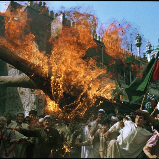 Anti-US demonstration in Peshawar, Pakistan, burn an effigy of President Bush during a rally outside a mosque. October 9, 2001

PH: John Stanmeyer-VII