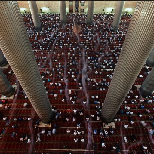 Thousands of Muslims take part in Friday prayers at the Central Mosque in Jakarta, Indonesia. 2000