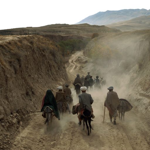 A family heading home with all their possessions on mules a day after the Taliban fell near Taliqan, Afghanistan. During the years of Taliban rule in northern Afghanistan most people lived in fear and fled their homes.
