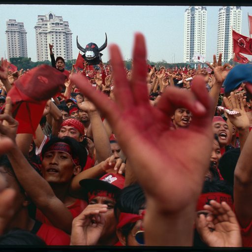 Thousands of Megawati supporters give the "bullet" symbol of support to Megawati Sukarnoputri during her last PDI rally in central Jakarta before the elections.June 1, 1999Photo by: John Stanmeyer / VII