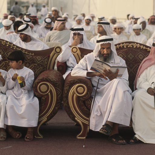 EMIRATI BOYS ENJOY JUICE AT THE SIDE OF THEIR VIP
ELDERS DURING A MASS WEDDING CEREMONY IN RAS AL
KHAIMAH, AN EMIRATE ABOUT 3 HOURS DRIVE FROM DUBAI,
IN THE U.A.E.  THE GOVERNMENT-SPONSORED MASS WEDDING, ATTENDED BY THE GROOMS AND MEN ONLY, IS HELD TO ENCOURAGE AND ASSIST EMIRATIS TO MARRY AND BUILD THE EMIRATI POPULATION.  WEDDINGS COST BIG BUCKS IN U.A.E.  THE WOMEN CELEBRATE IN PRIVATE SEPARATELY.