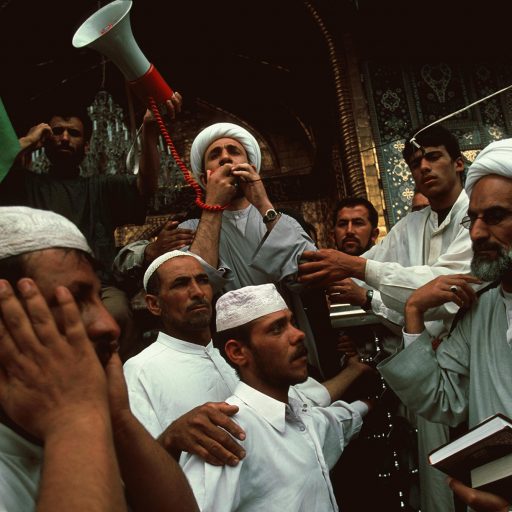 Ashoura celebrations. Shiite Imams gather inside the shrine of Kerbala, praying loud with microphone during the celebrations of the 40th day of Muharram, commemorating the martyrdom of Hussein.