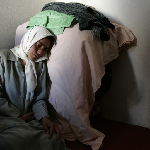 An Afghan women, suffering from depression, in her room at a shelter in Herat, Afghanistan, October 2004. The shelter, run by the humanitarian organization WASSA, provides accommodation and protection for 20 women who, in most cases, have fled their homes to escape domestic violence.Photo by: Alexandra Boulat / VII