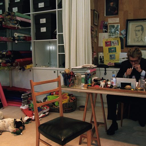 Yves Saint Laurent, and his dog Mudjik, working on his last collection at his parisian studio, Jan. 17, 2002. The show at Georges Pompidou Centre on Jan. 22, 2002 which featured 200 of his best creations since 1962, marked the retirement of Yves Saint Laurent after 40 years of designing haute couture for the rich and famous.Photo by: Alexandra Boulat / VII
