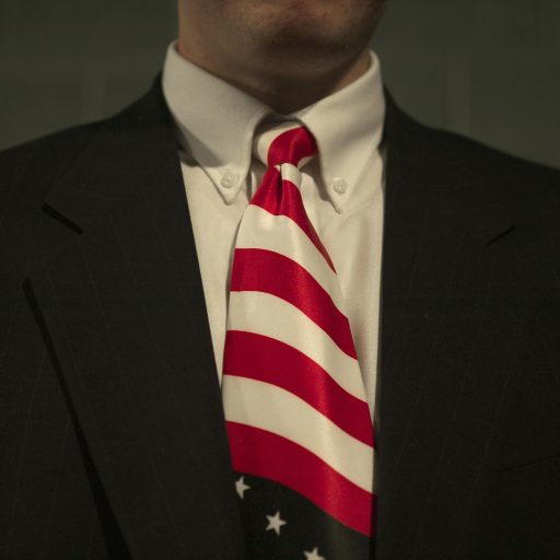 A high school students, wearing a tie bearing the American flag, listens to U.S. President George W. Bush speak about his Administration' s push for better jobs through education. Bush was visiting the Central Dauphin High School in Harrisburg, Pennsylvania, February 12, 2004.

Photo By: Christopher Morris / VII