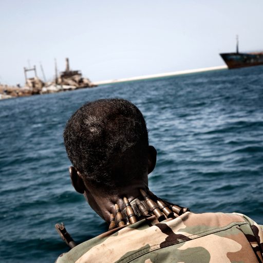 A soldier of the coastal guard of Somaliland patrols the harbor of Berbera, Somaliland on Sept. 26, 2009.