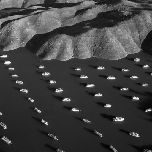 House boats are seen squeezed between the expanding exposed shoreline of Bidwell Canyon on Lake Oroville in Northern California. Lake Oroville is California's second largest reservoir, and it is shown 70% empty as a result of the state's severe drought.