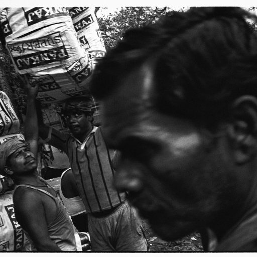 Men are seen in Phool Market in Kolkata, West Bengal, India on Jan. 10, 2009. Wars however unwelcome are violent interludes in the lives of the poor - there is less chance of outrunning poverty. When wars end the poor are still stalked by fear, fear of disease, injustice, unemployment, of getting sick, no housing and no education for their children - afraid their last meal was their last meal.