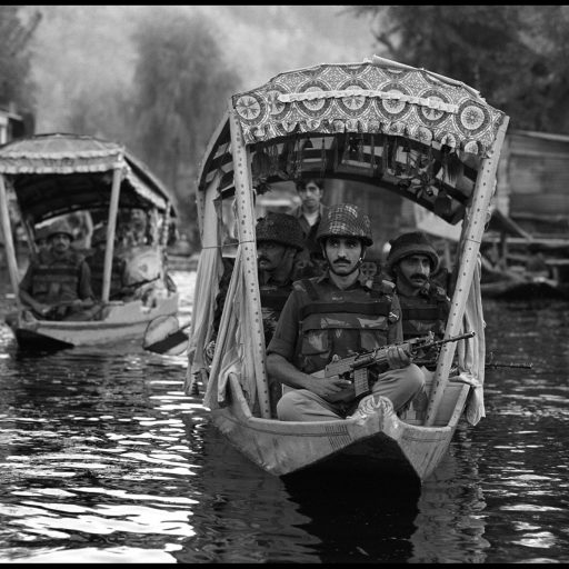The Special Boat Patrol of the Indian Army cruises the canals of Dal Lake, Srinagar, looking for pro-independent militants. A war is being fought in Kashmir between an alliance of Islamic militants and Kashmiri independence groups against 400,000 Indian troops who have conducted a brutal occupation that has resulted in the death of more than 80,000 Kashmiris.