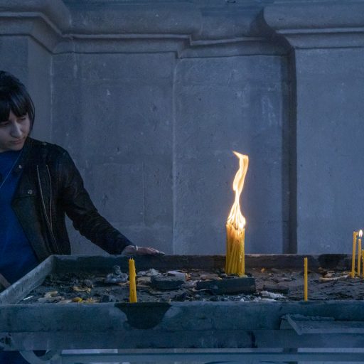 A woman looks at 31 candles she has lit for a missing soldier in Ghazanchetsots Cathedral in Shushi, Nagorno-Karabakh, on October 16, 2020. She notes that she lit as many candles as is his age. The cathedral was shelled twice on October 8, 2020. Armenians call this town Shushi while Azerbaijanis call it Shusha, the town came under Azerbaijan's control by the end of the Nagorno-Karabakh war.

The Nagorno-Karabakh war with Azerbaijan began on September 27, 2020. The fighting between Armenian and Azerbaijani forces quickly escalated from the frontlines to populated towns and villages, and ended on November 10, 2020. The war ended with a ceasefire negotiated by Russia, and with Azerbaijan gaining control of a part of Nagorno-Karabakh and surrounding regions. Over 5000 people died in the conflict, on both sides. Those living on lands that came under Azerbaijan's control, were displaced.