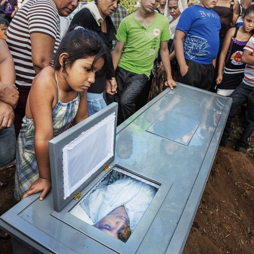 Family and friends gather for the funeral procession and burial of a former sugar cane worker, 36, who died of Chronic Kidney Disease of unknown origin (CKDu), after working in the sugar cane fields for 12 years in Chichigalpa, Nicaragua on Jan. 7, 2013.