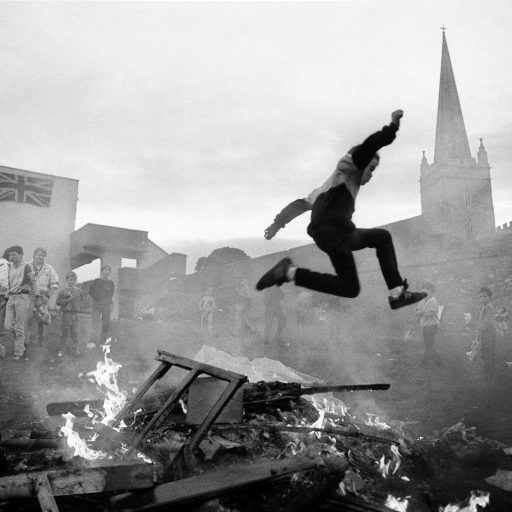 Protestant youth play around a bonfire in Londonderry, Northern Ireland. 1989