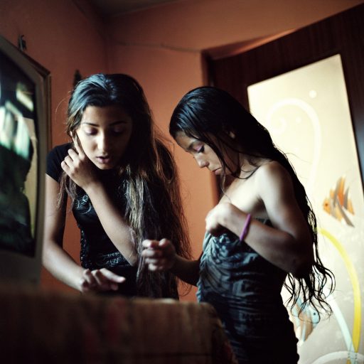 Ramona and Alexandra, two sisters from Tetila, Romania, put on makeup while getting ready, Ramona got married at 13 years old, while her 12 year old sister is to be wed in two years.