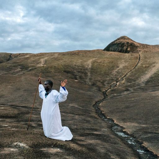 Bishop Manyange Chenjerai (40) sings his prayers to the Domboshawa mountains outside Harare, Zimbabwe, which are said to be sacred and have long been the site of pilgrimage for followers of varied religions, on March 13, 2018. Bishop Chenjerai has been coming to the mountain daily since 2008, when the country was thrown a downward spiral of rampant inflation and violent attacks following a contested election.

Much has been said about the poignant moment when Robert Mugabe, one of the world’s longest-serving heads of state, was finally forced from office. But missing from that narrative is a deeper exploration of what this new era means for the often divergent identities of Zimbabwe’s people.