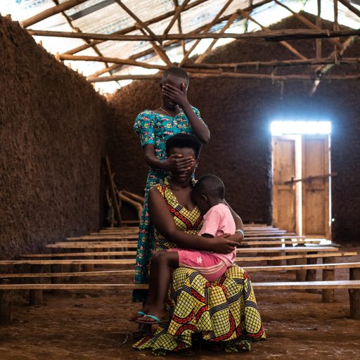 Portrait of Grace, 17, [not her real name], her three-year-old daughter, and her 14-year-old sister, in the church she sings at in Kyangwali refugee settlement, Uganda, on June 5, 2019. She fled to Uganda from Ituri province in the Democratic Republic of Congo and has been living in Kyangwali for the last three months. A group of armed men killed her parents and raped her outside her home in the DRC in an attack on their village. She eventually escaped and made her way to her uncle's home, and later discovered she was pregnant with her daughter. She was scared to seek out an abortion because she thought she would die.

South Sudan and the eastern Democratic Republic of Congo likely top the list of the world’s most dangerous countries for women, as militant groups have used extreme sexual violence as a weapon of war in both troubled nations. Uganda has become a temporary home for women fleeing both crises, and currently hosts more than 1.25 million refugees. But abortion in Uganda is almost entirely illegal, leaving women who find themselves pregnant from rape with few safe options. 

Globally, millions of women who have fled their homes because of conflict or crisis also face systemic rape and the resulting pregnancies. Despite the clear need -- refugee women face among the highest levels of sexual violence in the world -- abortion services are almost nonexistent in refugee camps. "Why don't women raped in conflict have a right to abortion?" is a question that indicts some of the most powerful individuals and institutions, while zeroing in on the experiences and stories of some of the most marginalized people.