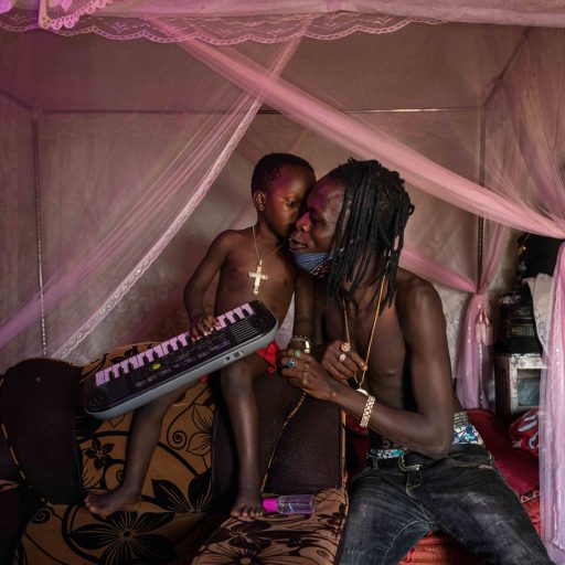 Musician Daniel Owino, who goes by the name Futwax, performs his latest song "Have you sanitized?" -- written and recorded in response to the ongoing coronavirus pandemic -- with his four-year-old son Julian Austin in their home in Nairobi's informal Kibera community, on April 1, 2020. "I'm a community leader and icon here, and people listen to my music across Kenya," said Futwax, also the former Mr. Kibera. "So it's my duty to make sure that everyone knows what's happening, and are doing what they can to try and stay safe. We have to be our own solution." 

Futwax also said: "Many people are still taking this too lightly. But if you've followed the situation in Italy, or Spain, we can assume that it's going to get much, much worse here. So I'm asking people, before they greet me, or say hello to my son, 'Have you sanitized?'
