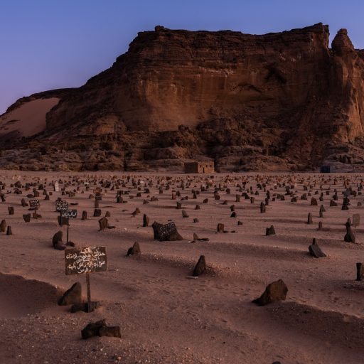 An Islamic cemetery spans the base of one side of Jebel Barkal, Sudan, a small butte that was considered sacred thousands of years ago, on February 4, 2020. Roughly a dozen pyramids are also scattered around the base of the mountain, as are the ruins of temples, statues, and hieroglyphics. One of the temples was dedicated to the god Amun, who was believed to live atop the butte.

The legendary Kingdom of Kush, with its capitals in what is now northern Sudan, helped define the political and cultural landscape of northeastern Africa for more than a thousand years. At their height, from about 760 B.C. to 650 B.C., five Kushite kings ruled all of Egypt from Nubia to the Mediterranean Sea, embarking on ambitious building programs up and down the Nile. Yet past archaeologists have offhandedly—and inaccurately—dismissed the Kushite kings as racially inferior and their accomplishments as an inheritance of older Egyptian traditions.

The story of these pyramid builders was recently evoked by the protesters in Sudan’s popular revolution that overthrew President Omar al-Bashir and ended his almost three decades in power. Protestors gathered in the thousands chanting “my grandfather was Taharqa, my grandmother was kandaka,” referencing the powerful King of Kush and an ancient term used for a queen. The queens of the Meroitic kingdoms conjure a prestigious past, against the current economic difficulties that have plagued Sudan. In a land often divided, this mythified, seemingly apolitical ancient history has also been seen as a way of building a more unified future.

Sudan has more - though smaller - pyramids than Egypt, but attracted only about 700,000 tourists in 2018 compared to some 10 million in its northern neighbor. Conflicts and crises under Omar al-Bashir, a tough visa regime and a lack of roads and decent hotels outside Khartoum have made Sudan an unlikely tourist destination. But Bashir lost power in April 2019, and the new civilian transition government i