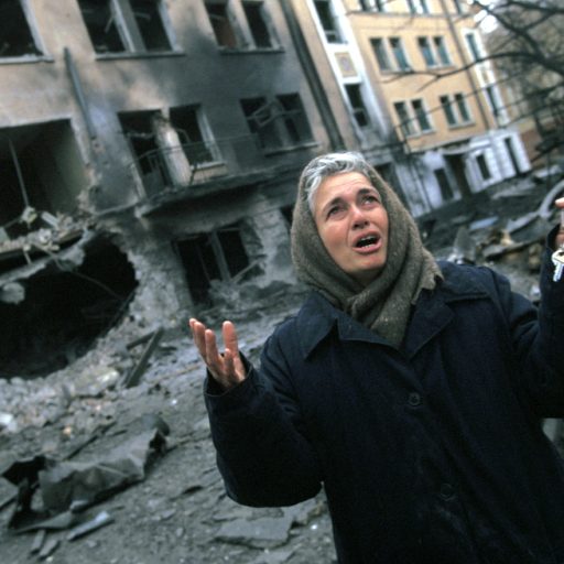 A Russian woman curses President Yeltsin after a Russian bombing attack which killed her mother.  She is holding the keys to her destroyed house.  The irony of Grozny is that many of the civilians left in the city were ethnic Russians with no family in the mountains and villages around the city to escape to, unlike most of the Chechens who were able to flee the city. In December 1994 Russian troops entered Chechnya in an attempt to quash the countryÕs independence movement.  Early promises of a quick victory were soon silenced as the Chechens put up fierce resistance to the Russian assault and the death toll mounted.  Up to 100,000 people Ð many of them civilians Ð are estimated to have been killed in the 20 month war that followed.
