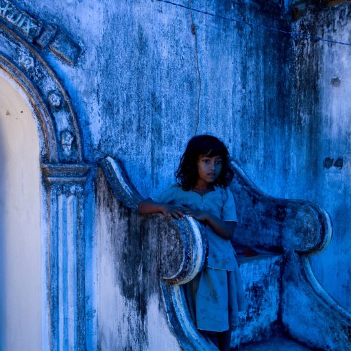 A displaced Muslim girl takes shelter at a destroyed mosque after fleeing a government offensive against the Tamil Tigers in Sri Lanka during one of the last battles of the civil war.