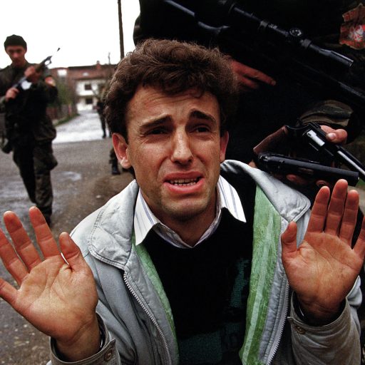 Harush Ziberi a Muslim man begs for his life from the Serbian paramilitary unit known as the Tigers and led by warlord Arkan during the first battle of the war in Bosnia. He was later thrown from a window during an interrogation and his remains were identified by DNA and found in a mass grave.