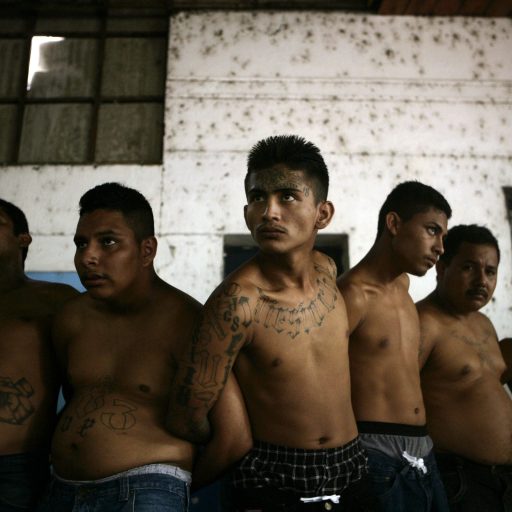 Suspected gang members, some wanted for murder, are presented by the National Police in El Salvador.
