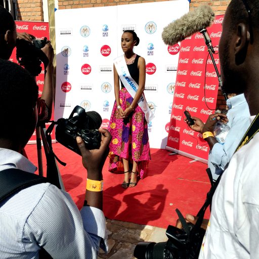 Miss Rwanda 2015 addresses a press conference outside a concert being held as part of Rwanda's official celebration of International Peace Day.

So much is hidden in plain sight. So much of the past – the past that no one talks about openly – is there for the seeing. A Rwandan colleague, a fellow photographer, who now lives in the US, returned for the first time in years not long ago to visit family. He has thought of the genocide as a visual atrocity – in which people were often singled out for death based solely on their looks, on whether they had the physical traits associated with Tutsis. 

He was startled to find that despite the national refrain of “We are all Rwandan,” the visual landscape – billboards, entertainment, advertising – was actually dominated by a specific physical type: the tall, slender, straight-nosed look of Tutsis. Watching the Miss Rwanda pageant in 2014, he was shocked to learn there was a height requirement for contestants. To enter, they had to be at least 1.63 cm (nearly 5’7”) tall, a restriction that all but virtually eliminated Hutu women, who are generally shorter, from the contest.

He says he needs to concentrate on the good things that are happening in Rwanda, on the committed relationships he sees between Hutus and Tutsis. It’s what gives him hope. But he remains uneasy about the future of his country. “The shadows,” he says, “are hiding lots of violence.”