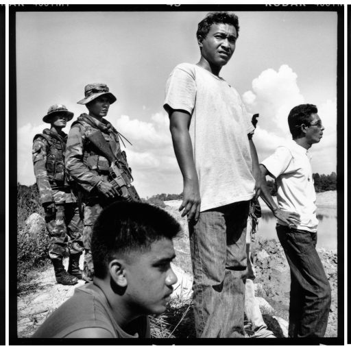 south thailand. Yala. Thai soldiers respond to the killing of a buddhist construction worker, shot dead while he slept in his bulldozer during a lunch-break. his body was then set on fire and the perpetrators escaped. 
In this triptych, soldiers and fellow workers are present as police forensic workers and foundation volunteers remove the body. 
(although a few of the soldiers appear in two frames, it paints a faithful picture of the scene as there were more soldiers present just out of frame.) 
May 19th 2007.