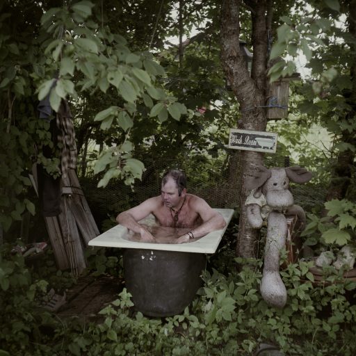 "The Forest King," Dagfinn Kolberg (53 years old), lives most of the year in the forest, either in a tent, under open skies, or in a cabin close to Vestfossen,  Norway. He photographs and films life in the forest and plays music, hugely inspired by Neil Yong. He is taking a bath outside, something he does in summer and winter. - A book by the American philosopher Henry D. Thoreaus changed my life. I was 20 years old. The book was "Life in the Forest" and it was a revelation for me. Even though it was written 150 years ago, the author had the same feelings as me: The society is hustle and bustle, I want to go away. At that time I tried to study at the University in Oslo, but I quit and moved to the forest. I have been here since.