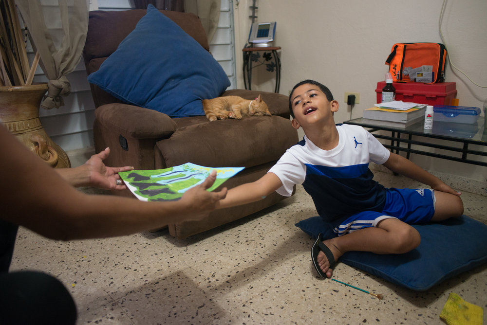  6/9/18 – Bayamón, Puerto Rico – Jayson Grau is a student in the second grade at Aurelio Perez Martinez, one of the schools set to close before the Fall. He tried another school before and had to repeat 1st grade, but has enjoyed Aurelio and thrived there, according to his mother and grandmother. The Puerto Rican Department of Education is closing 283 schools, and moving multiple schools into the same building, citing the past year’s drastic drop in enrollment as one of the primary reasons to lower the amount of schools, and instead increase the amount of students in each school. Students of special education schools are one of the groups to be most negatively affected by these closings, as the new schools may not offer the resources the students need and have access to at their current schools. (Sofie Hecht Photography) 