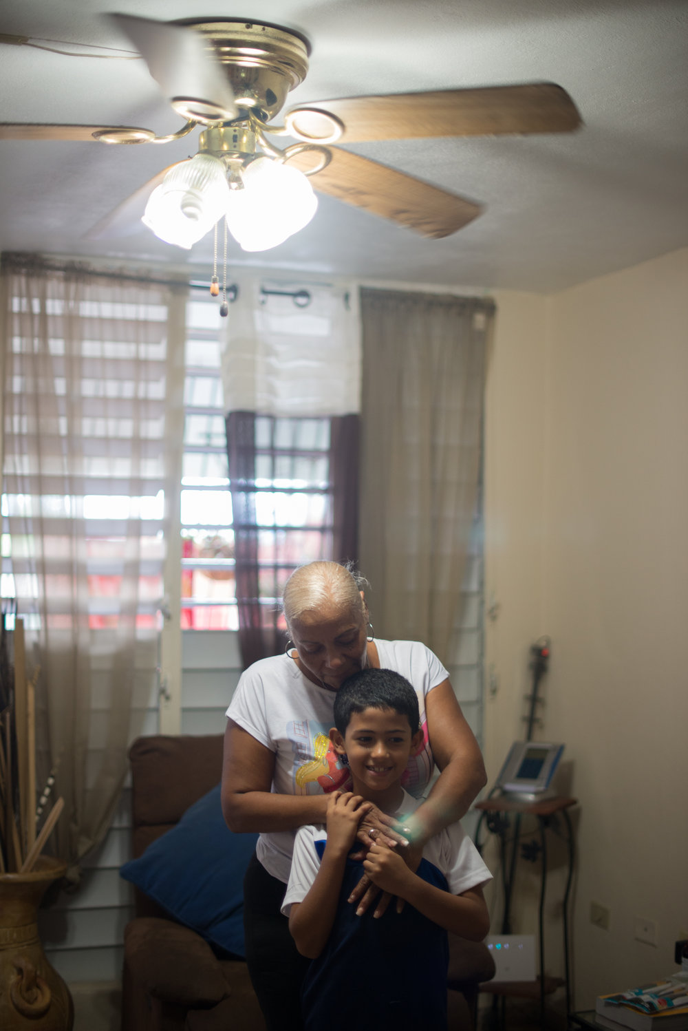  6/9/18 – Bayamón, Puerto Rico – Jayson Grau is a student in the second grade at Aurelio Perez Martinez, one of the schools set to close before the Fall. His grandmother Wanda takes the kids to school while their mother works, and lives at an apartment nearby to theirs so that she can help take care of the whole family. The Puerto Rican Department of Education is closing 283 schools, and moving multiple schools into the same building, citing the past year’s drastic drop in enrollment as one of the primary reasons to lower the amount of schools, and instead increase the amount of students in each school. Students of special education schools are one of the groups to be most negatively affected by these closings, as the new schools may not offer the resources the students need and have access to at their current schools. (Sofie Hecht Photography) 