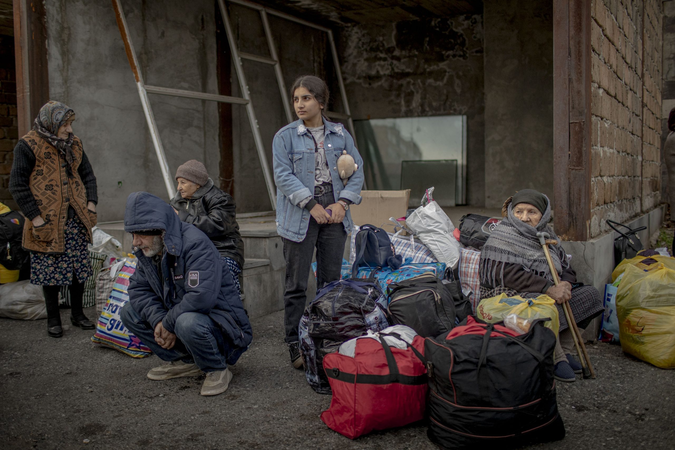 Families from Nagorno-Karabakh wait for busses to Stepanakert, in Yerevan, Armenia, on November 19, 2020. These families found refuge in Armenia during the days of the war and are now returning to their home towns and villages in Nagorno-Karabakh.