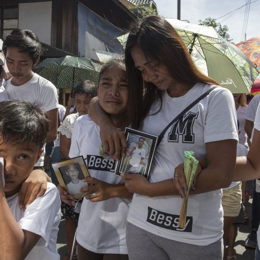 The family of Mark Salonga mourns during his burial procession in Taguig, south of Manila on November 12, 2017. Mark was said to have used marijuana and was killed by unknown suspects. He was 15 years old.
