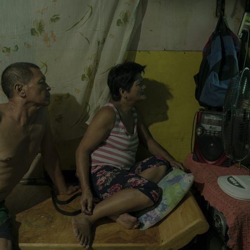 Nestor and Alma Hilbano watch the news on the second death anniversary of their son Richard on September 8, 2019. Richard and three others were killed in a police operation a couple of houses away in 2016.