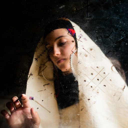 My cousin, Mira, wears our grandmother's tlaba (wool garment) to connect to her family roots and Amazigh culture, reviving the cultural heritage of the Nafusa mountains to keep it from being lost amid the chaos of fashion and imitation on October 28, 2018 in Yefren, Libya.