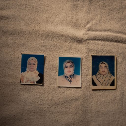 Photographs of Haroudas sisters, Rima, Hawa and Laila, who are amongst the victims of Al-Kaneyat massacres on February 22, 2021 in Tarhuna, Libya. (Photo by Nada Harib/Getty Images)