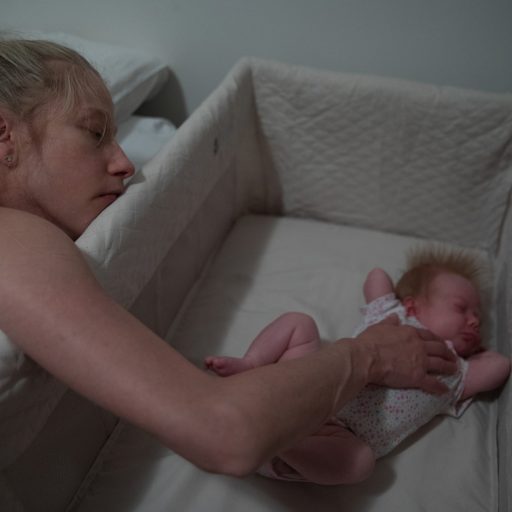 Photo by Jackie Molloy / VII Mentor Program. Sarah rolls over after just waking up to check on Charlotte McKnight on Aug. 6, 2019 in Manhattan, NY. Sarah made sure to check on the baby as soon as she woke up, "I have big fear of death since she was born, afraid of her dying, of me dying, my mom. I realized how much bigger life is now than just my own little world. My life expanded and now there is a lot more at stake."
