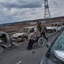 Photo by Eric Bouvet / VII. Irpin Bridge, Ukraine, March 7, 2022. Civilians attempt to flee the fighting in the Ukrainian city of Irpin.
