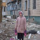 Photo by Eric Bouvet / VII. Dacha (10) remains in Irpin with her parents and sister near the front line, March 13, 2022.