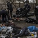 Photo by Ron Haviv / VII. Volunteers remove the bodies of eight Ukrainians that were said to be executed by Russians and found in the back of a building after the Russians left the area, on April 3, 2022 in Bucha, Ukraine.

Two of them were found with their hands tied behind their back.