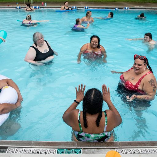 Women hang out in the pool and listen to Teri Collins tell them a story at Camp Roundup, a body positivity and acceptance camp for women that took place Labor Day weekend in Newark, Ohio. ©Jackie Molloy for the VII Mentor Program