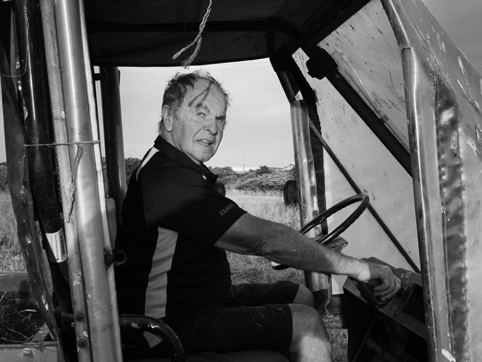 Retired Farmer Andy Davy looks at the camera as he drives his hay buggy. 24th January 2022 . Photo by Nick Netzler