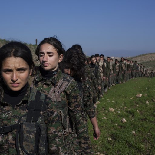 Young YPJ and YPG recruits participate in drills  the Kurdish area of Syria. The schedule is demanding and requires discipline: new soldiers in training get about 6 hours of sleep a night and wake up at 4 a.m; their day consists of a full schedule of drills and classroom lessons. Before joining the YPJ,YPG .Saemalka, Al Hasakah, Syria. December 21 2014.